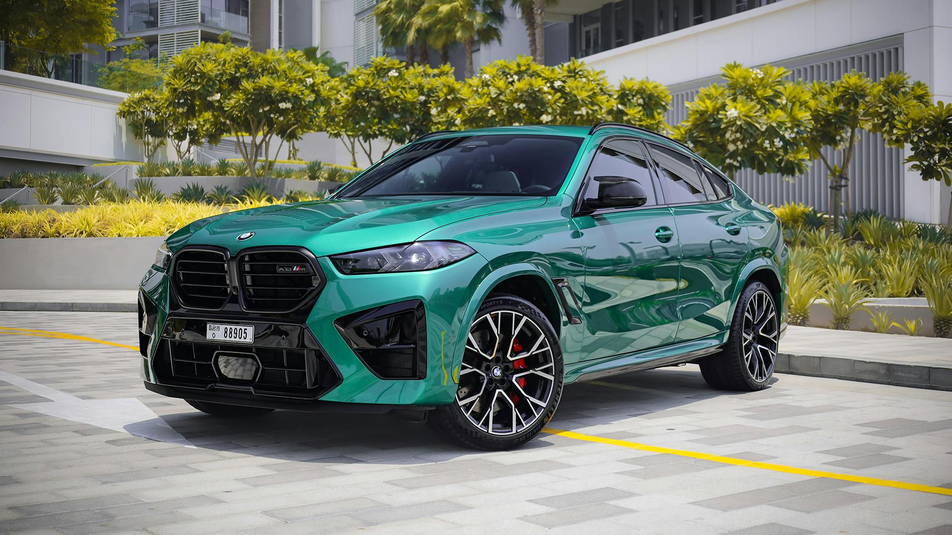 Green BMW X6M front side